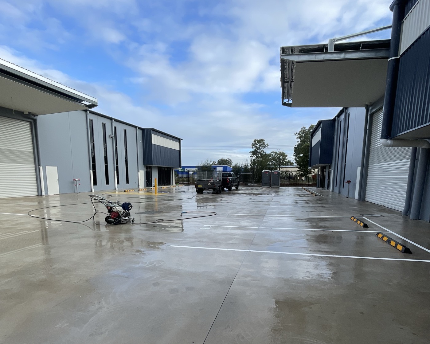 Freshly cleaned concrete slab on a commercial construction site in Newcastle